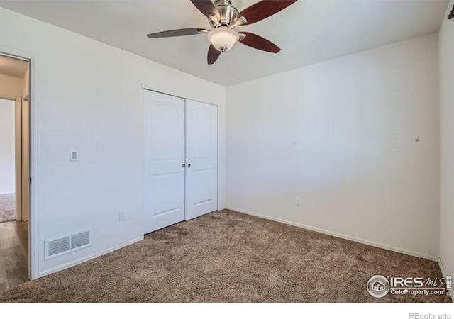 4134 Cypress Ridge Ln, Wellington, CO 80549 - unfurnished bedroom featuring carpet flooring, a closet, baseboards, and ceiling fan