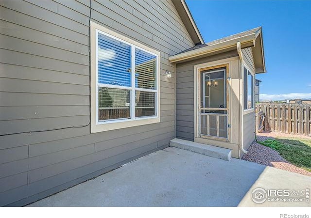 4134 Cypress Ridge Ln, Wellington, CO 80549 - doorway to property with a patio area and fence