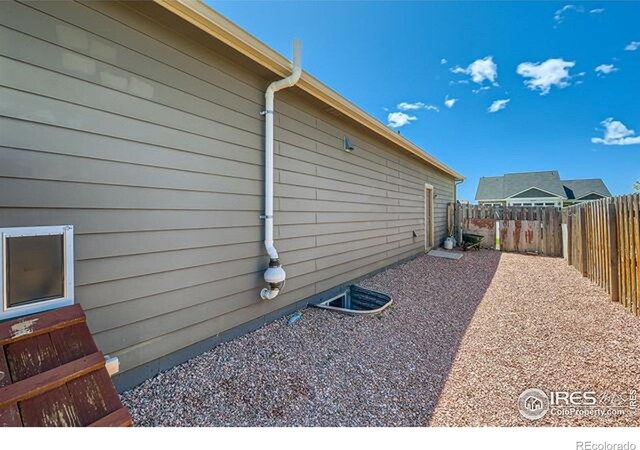 4134 Cypress Ridge Ln, Wellington, CO 80549 - view of home's exterior featuring a fenced backyard