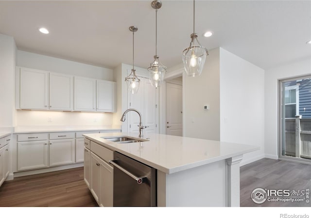 197 Liberty St, Erie, CO 80516 - kitchen with dishwasher, a sink, wood finished floors, white cabinets, and recessed lighting