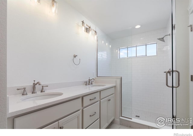 197 Liberty St, Erie, CO 80516 - bathroom with a stall shower, double vanity, and recessed lighting