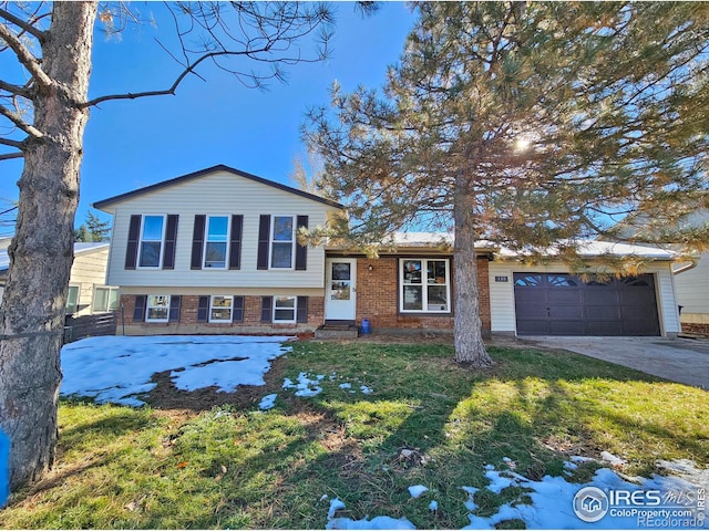 110 Lucerne Dr, Lafayette, CO 80026 - tri-level home featuring concrete driveway, a garage, brick siding, a front yard, and entry steps