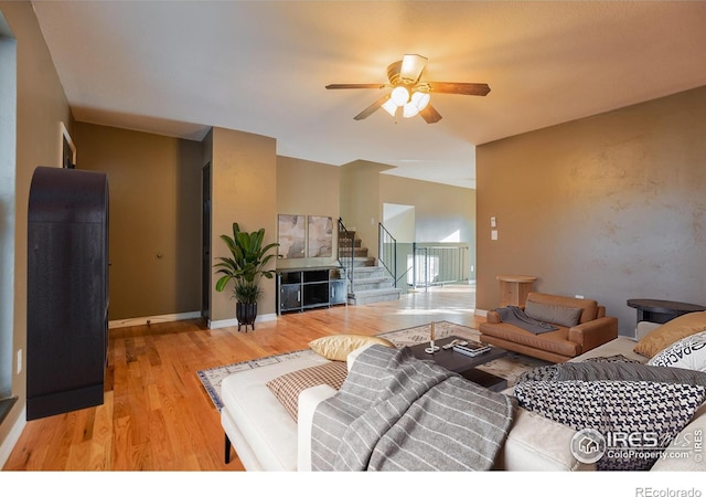 110 Lucerne Dr, Lafayette, CO 80026 - living room featuring ceiling fan, stairway, light wood-style flooring, and baseboards