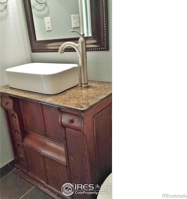 110 Lucerne Dr, Lafayette, CO 80026 - bathroom featuring vanity and a textured wall