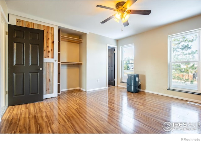 110 Lucerne Dr, Lafayette, CO 80026 - unfurnished bedroom featuring wood finished floors, baseboards, a closet, and ceiling fan