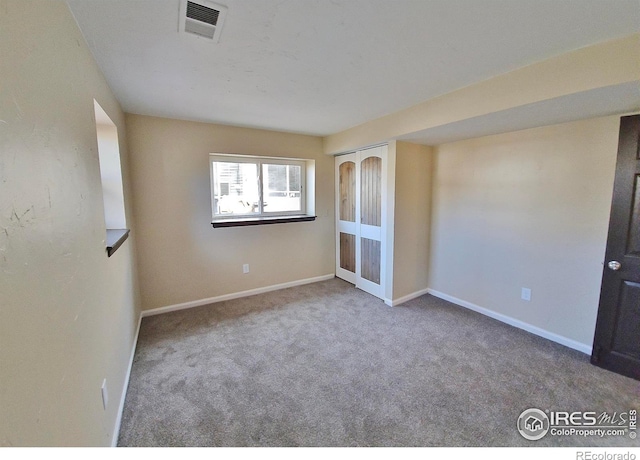 110 Lucerne Dr, Lafayette, CO 80026 - empty room featuring carpet, baseboards, and french doors