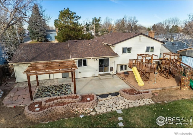 110 Lucerne Dr, Lafayette, CO 80026 - back of property featuring roof with shingles, a patio area, a playground, and a pergola