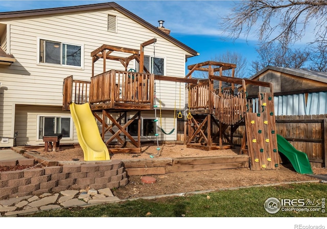110 Lucerne Dr, Lafayette, CO 80026 - view of play area with fence and a wooden deck