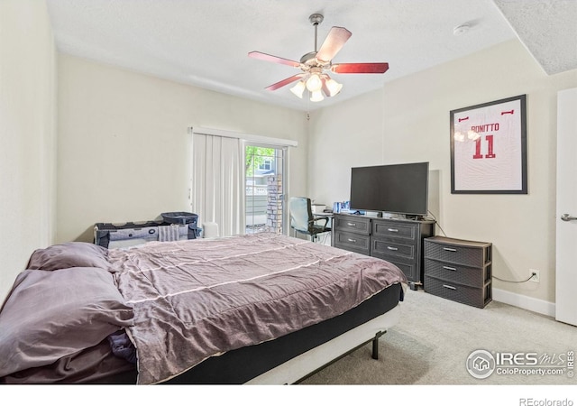 bedroom with carpet floors, ceiling fan, baseboards, and access to exterior