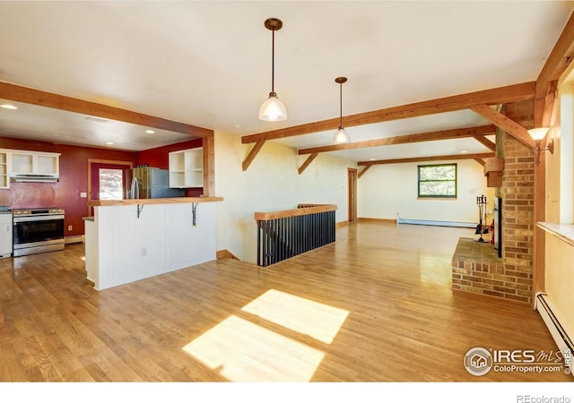 33090 Janelle Cir, Golden, CO 80403 - kitchen featuring appliances with stainless steel finishes, exhaust hood, open floor plan, healthy amount of natural light, and beam ceiling
