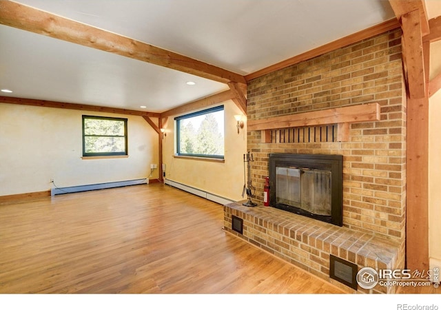 33090 Janelle Cir, Golden, CO 80403 - unfurnished living room featuring baseboard heating, a baseboard radiator, a brick fireplace, wood finished floors, and recessed lighting