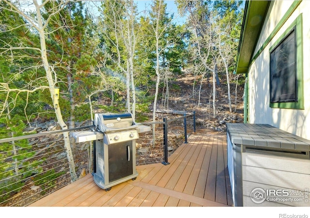 33090 Janelle Cir, Golden, CO 80403 - wooden deck featuring grilling area