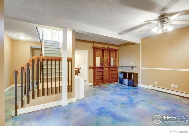 33090 Janelle Cir, Golden, CO 80403 - unfurnished living room featuring stairs, a textured ceiling, concrete flooring, a ceiling fan, and baseboard heating