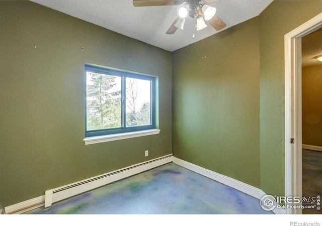 33090 Janelle Cir, Golden, CO 80403 - unfurnished room with baseboard heating, concrete floors, baseboards, and a ceiling fan