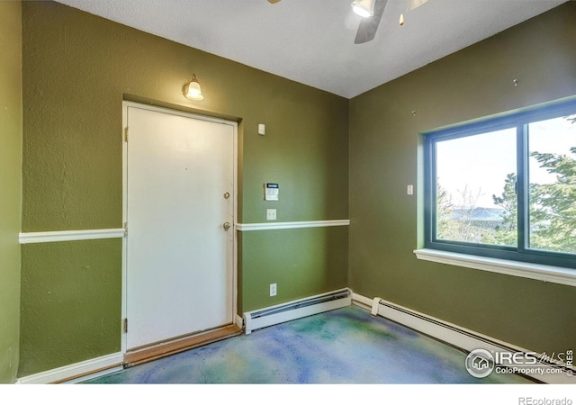 33090 Janelle Cir, Golden, CO 80403 - carpeted spare room with baseboard heating, healthy amount of natural light, ceiling fan, and baseboards