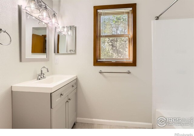 2962 Shadow Creek Dr Unit 306, Boulder, CO 80303 - bathroom featuring vanity and baseboards