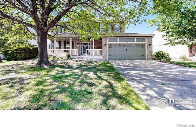 3221 Mesa Verde St, Fort Collins, CO 80525 - view of front of house with a porch, brick siding, an attached garage, and concrete driveway