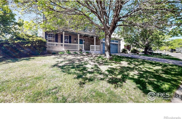 3221 Mesa Verde St, Fort Collins, CO 80525 - view of front facade with covered porch, driveway, a garage, a front lawn, and brick siding