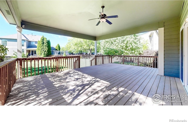 3221 Mesa Verde St, Fort Collins, CO 80525 - deck featuring a ceiling fan, fence, and a residential view