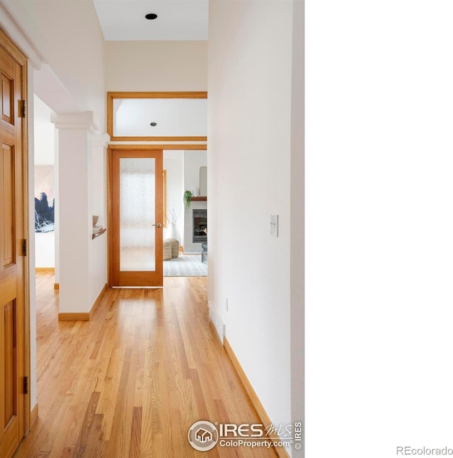 990 Utica Cir, Boulder, CO 80304 - corridor featuring light wood-style flooring and baseboards