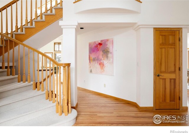 990 Utica Cir, Boulder, CO 80304 - staircase with wood finished floors and baseboards