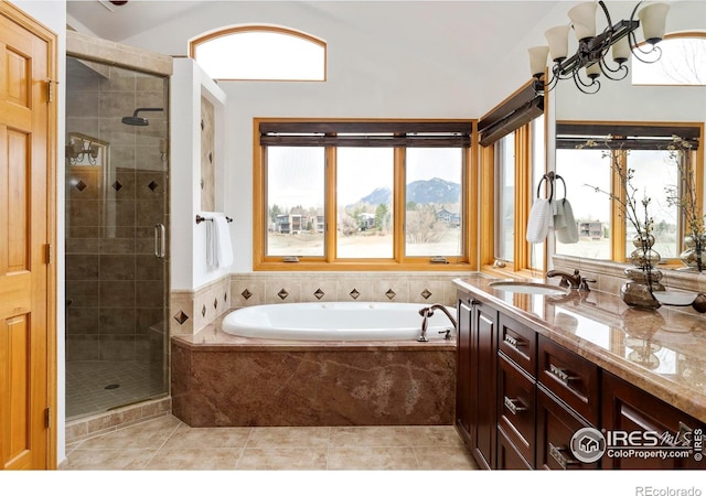 990 Utica Cir, Boulder, CO 80304 - full bath with a stall shower, a garden tub, vanity, tile patterned flooring, and a mountain view