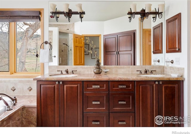 990 Utica Cir, Boulder, CO 80304 - full bathroom featuring a shower stall, a chandelier, double vanity, and a garden tub
