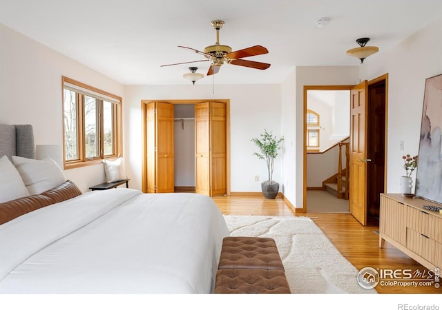 990 Utica Cir, Boulder, CO 80304 - bedroom with light wood-style flooring, a closet, baseboards, and ceiling fan