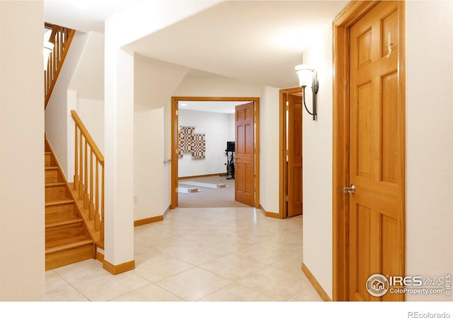 990 Utica Cir, Boulder, CO 80304 - corridor featuring stairs, baseboards, and light tile patterned floors