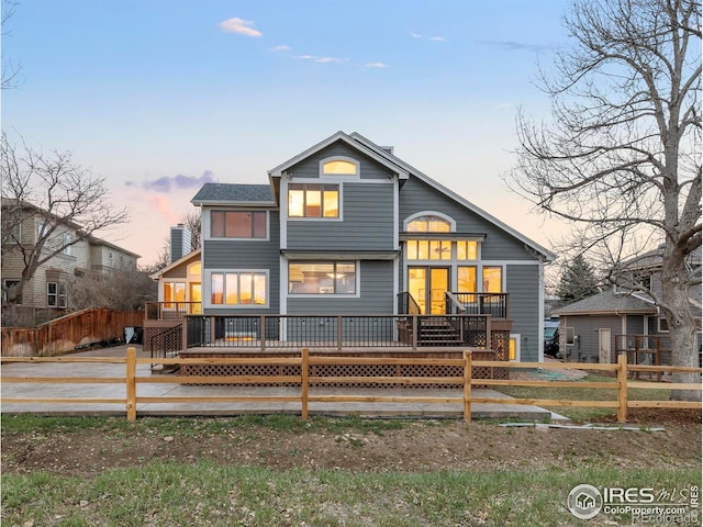 990 Utica Cir, Boulder, CO 80304 - back of house featuring a wooden deck and fence