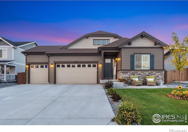 5524 Congressional Ct, Windsor, CO 80528 - view of front of property featuring a garage, concrete driveway, roof with shingles, and stone siding