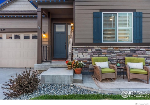 5524 Congressional Ct, Windsor, CO 80528 - view of exterior entry with a garage and stone siding