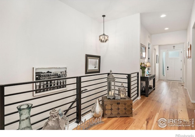 5524 Congressional Ct, Windsor, CO 80528 - hall featuring wood-type flooring, recessed lighting, an upstairs landing, and baseboards