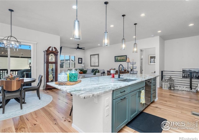 5524 Congressional Ct, Windsor, CO 80528 - kitchen featuring a sink, light wood-style floors, recessed lighting, dishwasher, and a ceiling fan