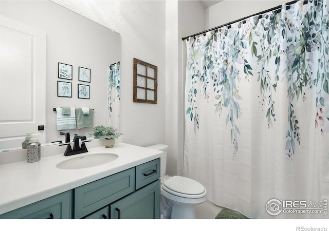 5524 Congressional Ct, Windsor, CO 80528 - bathroom with toilet, vanity, and a shower with curtain