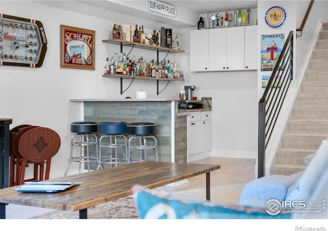 5524 Congressional Ct, Windsor, CO 80528 - indoor dry bar with stairway and baseboards