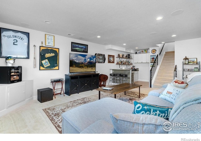 5524 Congressional Ct, Windsor, CO 80528 - living room with stairway, recessed lighting, bar area, baseboards, and light carpet