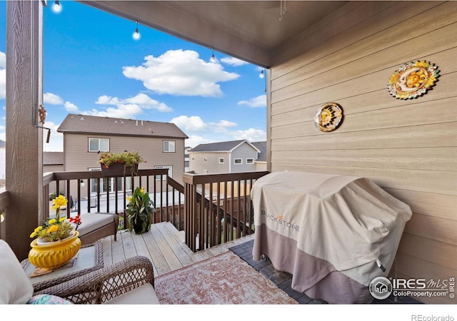 5524 Congressional Ct, Windsor, CO 80528 - wooden deck featuring area for grilling and a residential view