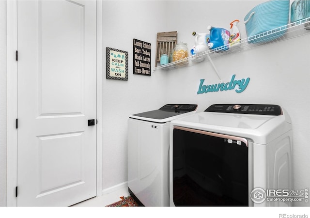 5524 Congressional Ct, Windsor, CO 80528 - washroom with washing machine and dryer and baseboards