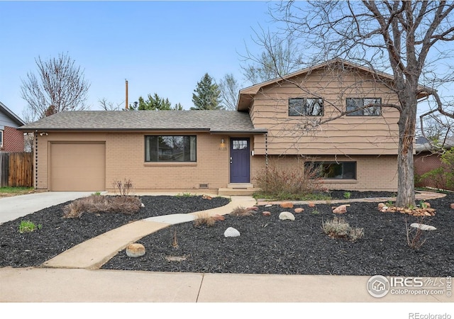 4035 Darley Ave, Boulder, CO 80305 - split level home with brick siding, a garage, driveway, and fence