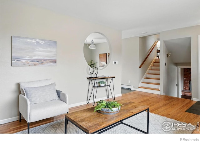 4035 Darley Ave, Boulder, CO 80305 - living area with a baseboard radiator, stairway, wood finished floors, and baseboards