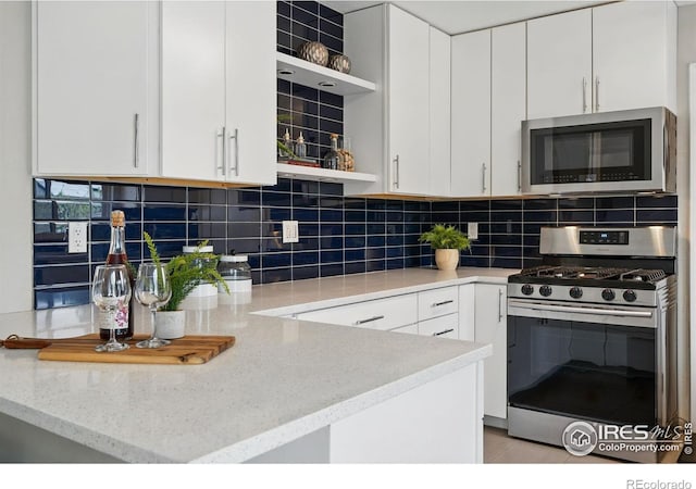 4035 Darley Ave, Boulder, CO 80305 - kitchen with open shelves, appliances with stainless steel finishes, white cabinetry, light stone counters, and tasteful backsplash