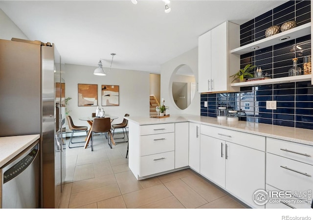 4035 Darley Ave, Boulder, CO 80305 - kitchen with open shelves, stainless steel appliances, backsplash, light countertops, and a peninsula