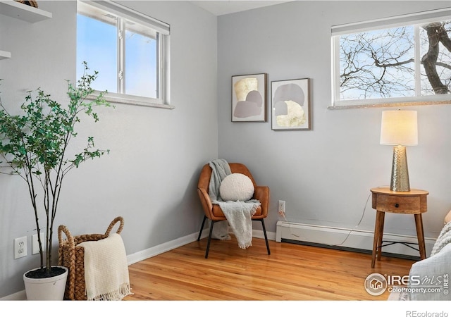 4035 Darley Ave, Boulder, CO 80305 - living area with a baseboard radiator, wood finished floors, and baseboards