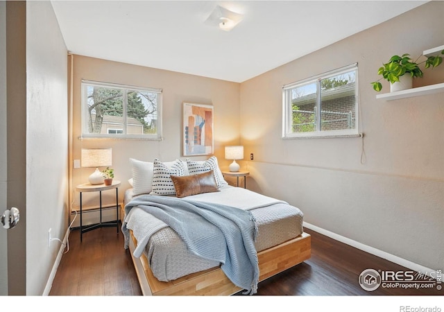4035 Darley Ave, Boulder, CO 80305 - bedroom featuring multiple windows, wood finished floors, baseboards, and baseboard heating