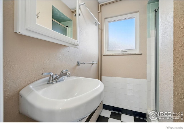 4035 Darley Ave, Boulder, CO 80305 - full bathroom featuring a sink, a textured wall, and an enclosed shower