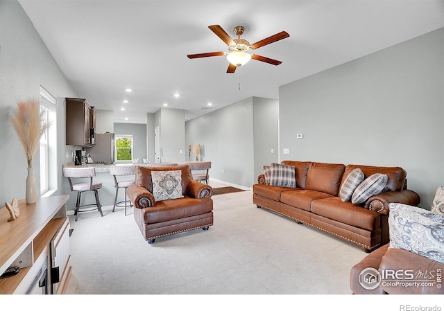 living area featuring a ceiling fan and recessed lighting