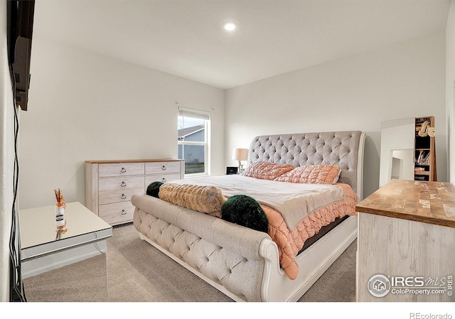 carpeted bedroom featuring recessed lighting