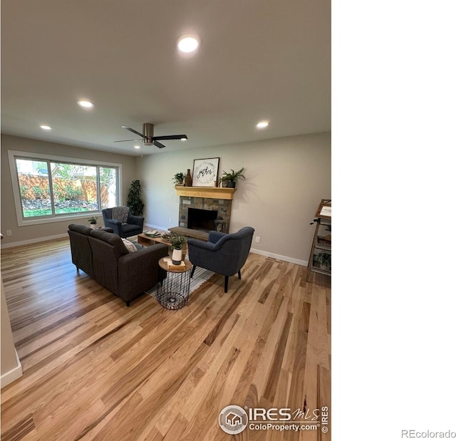 1225 Ithaca Dr, Boulder, CO 80305 - living area with light wood-style flooring, a fireplace, baseboards, recessed lighting, and ceiling fan