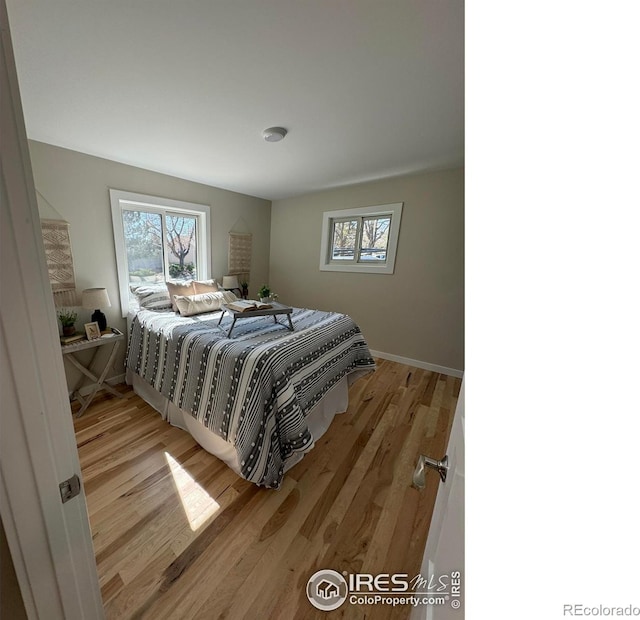 1225 Ithaca Dr, Boulder, CO 80305 - bedroom featuring light wood-style floors and baseboards